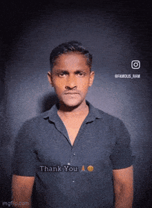 a man in a black shirt says " thank you " in front of a black background