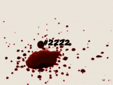 a splash of red liquid with the number 2222 on the bottom