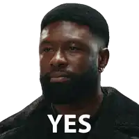 a man with a beard says yes with a white background