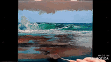 a painting of waves on a beach is being made by animatica