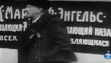 a man is standing in front of a sign that says map
