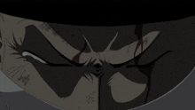 a close up of a man 's face with a tear running down his cheek