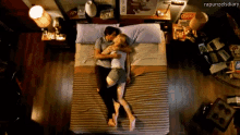a man and a woman are laying on a bed with the words rapunzelsdiary written on the bottom