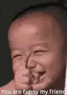 a baby making a funny face with the words " you are funny my friend " above it