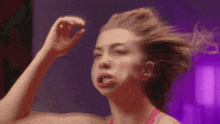 a woman is making a funny face with her tongue sticking out