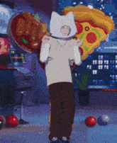 a person wearing a cat hat is standing in front of a large pizza