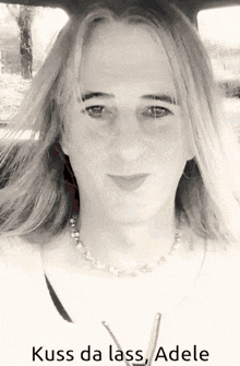 a black and white photo of a woman with the words kuss da lass adele