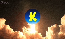 a rocket is being launched with a blue circle with the letter k on it