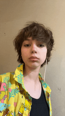 a girl wearing a yellow shirt with spongebob squarepants on it