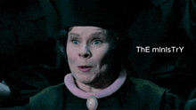 a woman in a graduation cap and gown with the words " the ministry " on the bottom