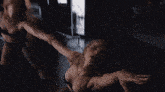 a blurry photo of a woman in a black leotard