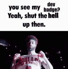 a man in a bulls jersey has his fist in the air and says " dev you see my badge yeah shut the hell up then "