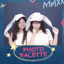 two girls wearing bunny hats are standing next to each other in front of a blue background that says photo palette