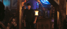 a man in a black shirt is screaming with his mouth open