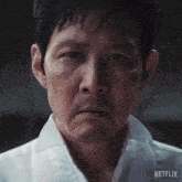 a close up of a man 's face with netflix written on the bottom right