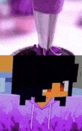 purple frosting is being piped onto a cupcake with a pixelated face