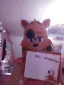 a stuffed animal is holding a card that says " oh marie "