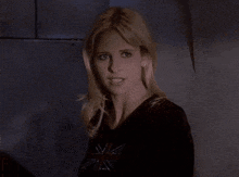 a woman with blonde hair is making a funny face and saying psyche