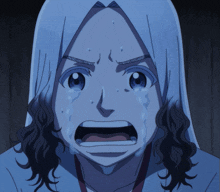 a girl with long hair is crying with tears coming out of her eyes