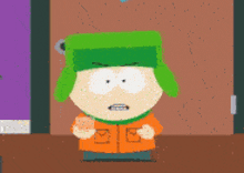 a cartoon character wearing a green hat and an orange shirt is standing in front of a door .