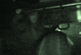 a person is hanging from a railing on a train
