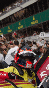 a man wearing a helmet and a yellow jacket with the word cen on it