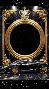a black car is in front of a gold frame with a crown