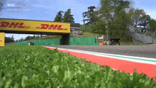 a race track with a dhl sign on it