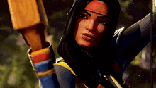 a woman with long black hair is holding a bow and arrow in her hand .