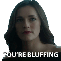 a woman with a sticker that says you 're bluffing on it