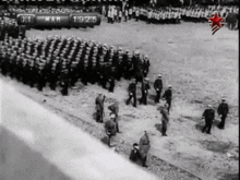a black and white photo of a military parade with the date of march 19 1915