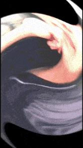 a blurry picture of a person 's face with a purple background
