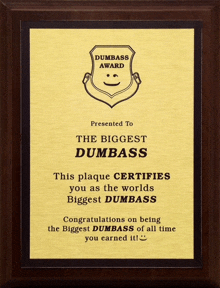a gold plaque that says dumb ass award