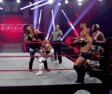 a wrestling ring with the word impact wrestling on it