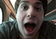 a close up of a man with his mouth wide open