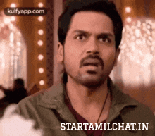 a man with a beard is making a funny face and the words starttamilchat.in are on the bottom of the image .