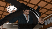 a man in a suit is holding another man upside down and says " aghhhhh "