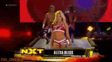 a woman named alexa bliss is walking down a ramp in a wrestling match