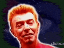 a man with red hair is making a funny face with his eyes closed and a green background .
