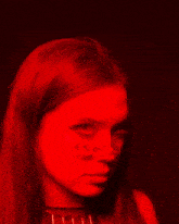 a woman with a red light behind her that says 4 mi
