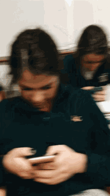 a blurry picture of a girl wearing a lacoste sweatshirt
