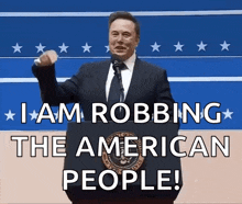 a man stands at a podium with the words " i am robbing the american people "