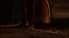 a man with white hair is holding a sword in his hand