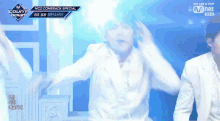 a man in a white suit is dancing on a mcd comeback special show