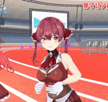 a girl with red hair is standing on a track with a sign in the background that says #marin
