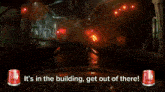 a screen shot of a roller coaster with the words " it 's in the building get out of there " at the bottom