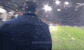 a man walking on a soccer field with the hashtag @nocontextnapoli on the bottom