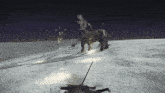 a man riding a horse in a snowy field
