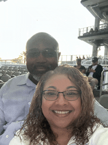 a man and a woman are posing for a picture
