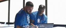 two men looking at a laptop with the words just listen to ado written on the bottom